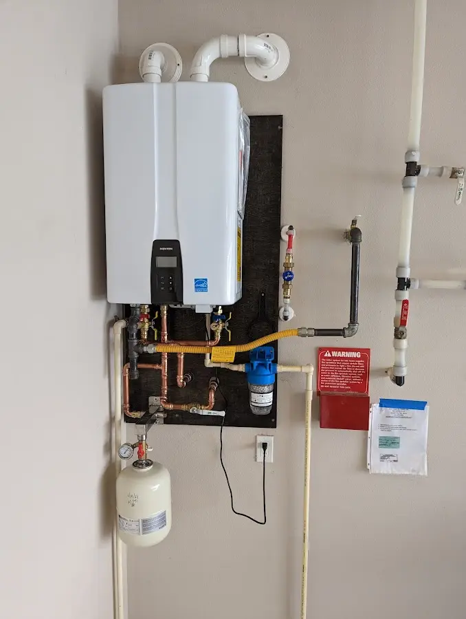 Professional plumber installing copper piping in a Berkeley Heights home